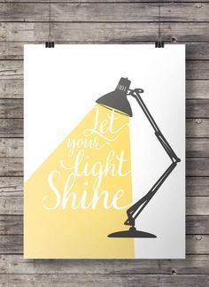 a poster with the words let your light shine on it, and a lamp shade