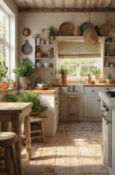 a kitchen filled with lots of pots and pans next to a stove top oven