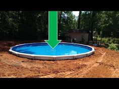 an above ground swimming pool with a green arrow pointing to the water in front of it