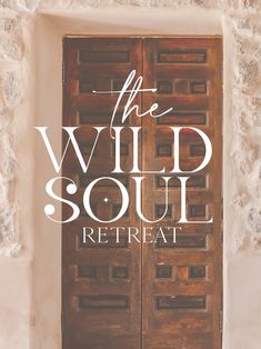 the wild soul re - treat is on display in front of a stone wall with an open door