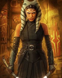 a woman dressed in star wars garb holding two swords and wearing an egyptian headdress