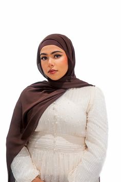 Discover the ultimate in luxury and coverage with our exclusive matching hijab and undercap set. Crafted from luxurious, soft, buttery and opaque chiffon, the elegantly tailored hijabs feature a breathable and tieback bamboo jersey undercap to keep your hair hydrated all day. These hijabs provide the ultimate coverage with approximately 80% opacity. Whether you're looking for a casual or dressy look, this timeless hijab and undercap set is sure to complete your sophisticated ensemble. Head Coverings, Head Covering, Dark Chocolate, Chiffon, Hair