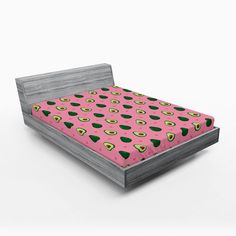 a bed with an avocado print on it