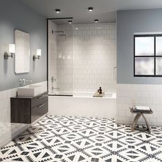 a bathroom with black and white tile flooring next to a bathtub in the corner