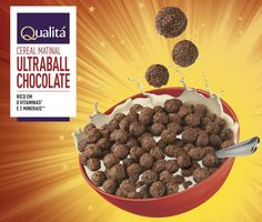 cereal is falling into a bowl with chocolate balls in it and milk splashing out of the bowl