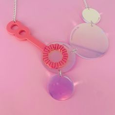 Bubble necklace is a fun and quirky piece to pair with a your outfit. The necklace is made from pink and our fabulous translucent acrylic. The bubbles change colour slightly in the light and are linked together using jump rings. It comes with a curb chain in a choice of two colours.  If you have any questions drop us a line!💌 We are more than happy to help😁 To clean your necklace you can simply wipe with a glasses cloth or soft cloth to remove finger marks. Acrylic is a fragile material so please store in a jewellery box to prevent damage.  As ever for safety please keep away from small children. Perspex Jewelry, Fused Plastic, Plastic Jewellery, Glowforge Ideas, Bubble Necklace, Weird Jewelry, Laser Projects, Fish Jewelry, Laser Cut Jewelry