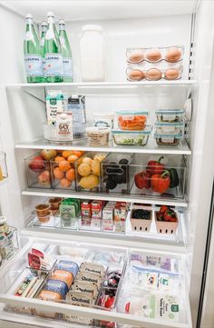 an open refrigerator filled with lots of food