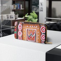 Brown Orange Green Aztec Pattern Womens Zipper Wallet Clutch Purse. This stylish and functional Zipper Wallet is the perfect accessory to keep your essentials organized and secure. Using high-quality materials, it is crafted with meticulous attention to detail ensuring its longevity and resistance to wear and tear. The interior of the wallet is lined with a smooth fabric that prevents scratches on your items and provides a pleasant tactile experience every time you use it. This wallet combines fashion and practicality to meet all your daily needs. Whether you're shopping for yourself or a gift for a loved one, the Zipper Wallet makes for an ideal gift choice. Its practicality and style will surely be appreciated by anyone who receives it. .: Material: Faux Leather waterproof material, rein Casual Multicolor Wallets With Zipper Closure, Cheap Multicolor Wallet With Zipper Closure, Cheap Bohemian Multicolor Wallets, Cheap Orange Wallet, Cheap Orange Rectangular Wallets, Aztec Pattern, Zipper Wallet, Clutch Wallet, Clutch Purse