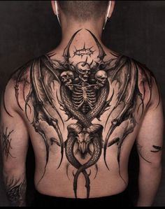 a man with tattoos on his back