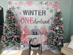 a decorated christmas tree display in front of a sign that says winter onederland