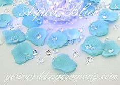 blue flowers and crystal stones on a white surface