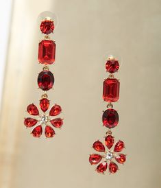 These dazzling drop earrings boast shimmering red rhinestones set in golden hardware in a tiered design with a floral pendant. Complete with post backs. Available while supplies last. Earrings Western, Red Jewelry, Floral Pendant, Red Felt, Glitter Bow, Earrings Red, Red Earrings, Red Rhinestone, Big Earrings