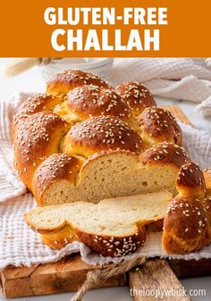 a loaf of gluten - free challah on top of a cutting board