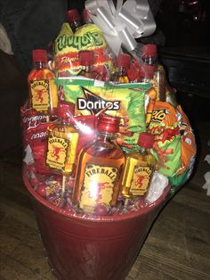 a red bucket filled with lots of condiments