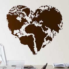 a heart shaped world map wall decal in brown