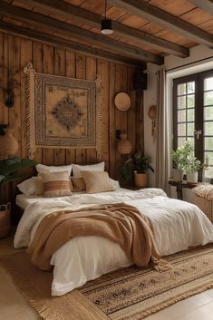 a bedroom with wood paneled walls and white bedding, rugs on the floor