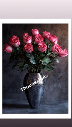 a vase filled with pink roses sitting on top of a table next to a wall