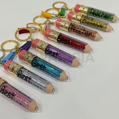 ✏️ 3D Pencil Chain, Custom Name, Personalized Teacher Name, Teacher Appreciation Gift, Backpack Tag, custom teacher pencil, Teacher Gift, Christmas ✏️ The perfect gift for your favorite teacher! Each pencil is made of plastic and filled with glitter. Each one has a matching tassel. ✏️ This listing is for only ONE pencil keychain + Tassel matching the color. ✏️ Can be great accessories for your backpack or your bag. ✏️ If you're looking for wholesale or bulk orders please, contact me for any info Pencil Teacher Gift, Customized Multicolor Keychains For School, Personalized Adjustable Lanyard For Teacher Appreciation, Teacher Pencil Keychain, Pencil Keychain, Gift Backpack, Customizable Pencil-shaped Pencil Case For Back To School, Teacher Gift Christmas, Personalized Multicolor Pencil-shaped Pencil Case