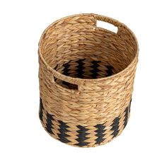 a woven basket with black and white designs on the bottom, sitting in front of a white background