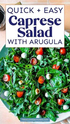 a white plate topped with spinach and tomatoes