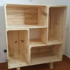 a wooden shelf sitting on top of a tiled floor