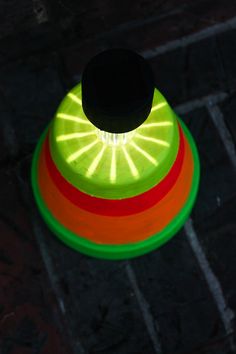 an overhead view of a frisbee on the ground with light coming through it