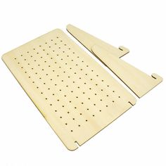 two wooden cutting boards with holes on them