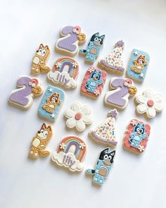 decorated cookies are arranged in the shape of numbers for birthdays and special occasiones