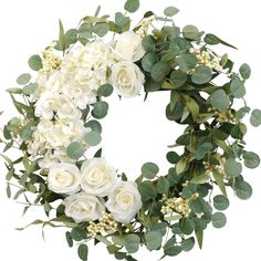 a wreath with white flowers and green leaves