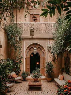 an outdoor courtyard with potted plants and seating