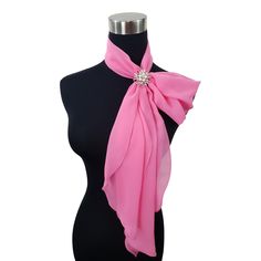 Neckline leaves you feeling a little bare? Maybe you need a pop of colour. Our lightweight chiffon neck scarf was created just for you. Wear it all different ways for different looks. With one, two or three ring options, this set makes a great gift for a special lady - especially a mum or grand mother. Our scarf has tapered ends which fall softly when threaded through the scarf ring. Can be worn with our U Wrap - the versatile cover up. Comes with handy zip up travel pouch and presented in a sty Elegant Pink Scarf For Formal Occasions, Chic Pink Scarf As Gift, Elegant Pink Scarves For Wedding, Elegant Formal Pink Scarves, Elegant Pink Formal Scarves, Elegant Adjustable Scarf Neckwear, Luxury Satin Scarves For Women, Luxury Silk Chiffon Elegant Scarves, Elegant Flower-shaped Silk Scarf For Gift