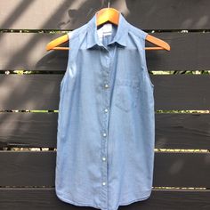 Gap Chambray Button Down Sleeveless Collar Shirt. 100% Cotton, Airy Fabric. New Without Tags In Perfect Condition. Pit To Pit 18" Length Front 25" Casual Denim Sleeveless Vest With Snap Buttons, Casual Sleeveless Denim Vest For Work, Cotton Button-up Vest, Summer Denim Vest With Buttons For Workwear, Cotton Button-up Vest With Buttons, Blue Button-up Denim Vest For Work, Gap Sleeveless Tops For Everyday Wear, Casual Cotton Vest With Snap Buttons, Sleeveless Everyday Tops By Gap