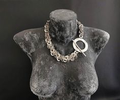 Oversized asymmetrical silver plated stylized brass chain necklace. It is a stunning piece, perfect to make everyone's attention turned on you. The size: 52 cm / 20.50 inches Please, note that many of our jewelry has been through an oxidation process. Therefore, some natural black marks or imperfections on production may occur for a more obvious vintage-aged tone but oxidation naturally wears off over time. Please contact me if you have any questions. Thanks for looking! Shipping costs do not in Modern Metal Chain Necklace With Chunky Chain, Modern Chain Link Necklace, Modern Metal Jewelry With Chunky Chain, Modern Jewelry Chunky Chain Choker, Modern Chunky Chain Choker Jewelry, Modern Link Jewelry For Party, Modern Chunky Chain Choker Necklace, Chic Silver Round Chain Necklace, Unique Chunky Chain Necklaces As Gift