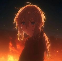 a girl with blonde hair standing in front of a blazing sky and looking at the camera