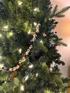 a christmas tree with lights and decorations on it