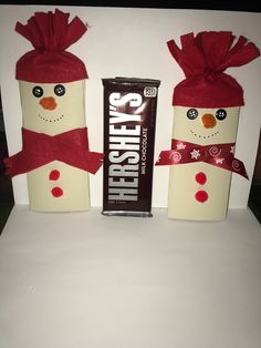 two snowmen made out of candy boxes