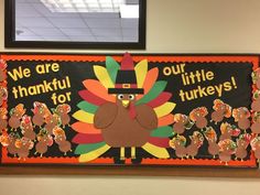 a bulletin board decorated with turkeys for thanksgiving