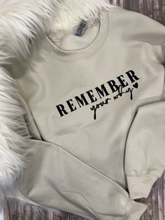 Embroidered on the front of this soft comfy crewneck sweatshirt are the inspirational words "Remember Your Why" with heart.  This Crewneck comes in unisex sizes and are Gilden heavy blend fleece and are super soft and so comfy and roomy. Several colors to choose from.  You can also choose a full Zip Up Hoodie with the words on the left chest.  Then choose to personalize the sleeves with names and heart. This will for sure be your go to crewneck or hoodie when you want to throw on something warm and cozy and it's super cute and trendy.  **PLEASE NOTE: IF CHOOSING ZIP UP HOODIE THE WORDS "REMEMBER YOUR WHY" WILL BE ON THE LEFT CHEST** HOW TO PLACE ORDER: 1) Choose Style and Size of shirt 2) In the Personalization section indicate Color of shirt from the photos 3) Indicate thread color 4) Ind Inspirational Cotton Crew Neck Sweatshirt, Inspirational Text Print Sweatshirt With Relaxed Fit, Inspirational Crew Neck Sweatshirt In Relaxed Fit, Sleeves With Names, Remember Your Why, Full Zip Up Hoodie, Comfy Crewneck, Embroidered Crewneck, Custom Sweatshirts