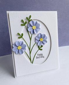 a card with blue flowers on it and the words happy birthday written in white paper