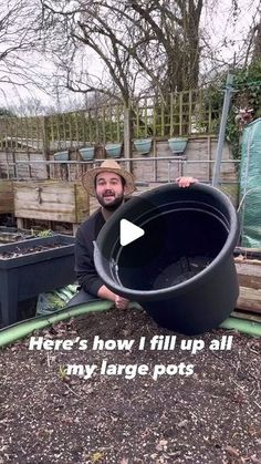 a man is holding a large pot in his garden with the words here's how i fill up all my large pots