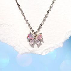 Transform your world with the Kaleidoscope Butterfly Necklace, a playful piece that adds a touch of magic to your everyday style. Delicately crafted to reflect an array of colors, this petite and cute necklace is reminiscent of a rainbow fluttering over your head - it's easy to get lost in its beauty! Rainbow Flower-shaped Jewelry For Gifts, Flower Butterfly Charm Jewelry Gift, Flower Shaped Butterfly Charm Jewelry As Gift, Flower-shaped Butterfly Charm Jewelry Gift, Flower Shaped Butterfly Charm Jewelry Gift, Dainty Pink Butterfly Necklace For Gift, Dainty Pink Butterfly Necklace As Gift, Dainty Pink Butterfly Necklace As A Gift, Elegant Multicolor Butterfly Necklace As A Gift