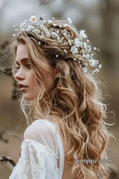 a woman with long hair wearing a white dress and a flower crown on her head