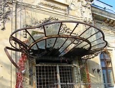 an old building with iron bars on the door