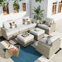 an outdoor living room with wicker furniture