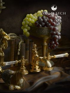 a bunch of grapes sitting on top of a table next to books and wine glasses