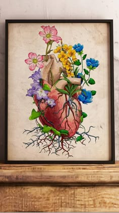 a painting with flowers in the shape of a heart on top of a wooden shelf