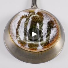 a metal object with snow on it and a video playing in the bottom right corner