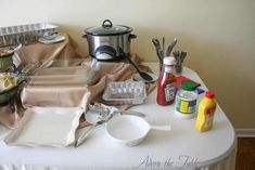 the table is covered with dishes and utensils