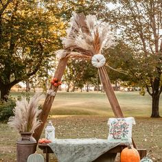 an outdoor setting with pumpkins, hay and other decorations