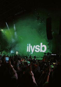 a large group of people standing on top of a stage